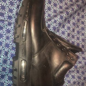 (With laces) black Nike boots